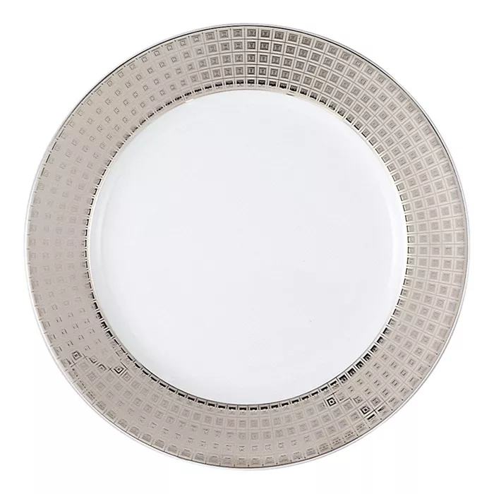 The Bernardaud Athena Platinum Dinnerware features a round white porcelain plate with a glossy center and a wide platinum rim adorned with a geometric grid pattern, adding an elegant touch to your table setting.