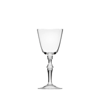 The Moser Mozart wine glass features a clear bowl and an ornate stem, shown centered on a white background.