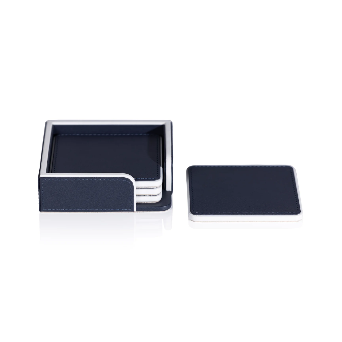 The Zodax Napoli Leather Coaster Set of 4 in navy and white features square cream Nappa leather coasters with white edges in a matching holder; one coaster is displayed outside the holder on a white background.