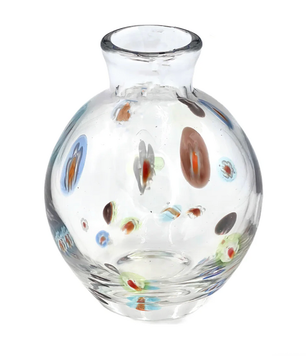 The Abigails Cello Dots Bud Vase - Clear features a round glass design with a short neck and is adorned with playful blue, brown, green, and red spots scattered across its surface.
