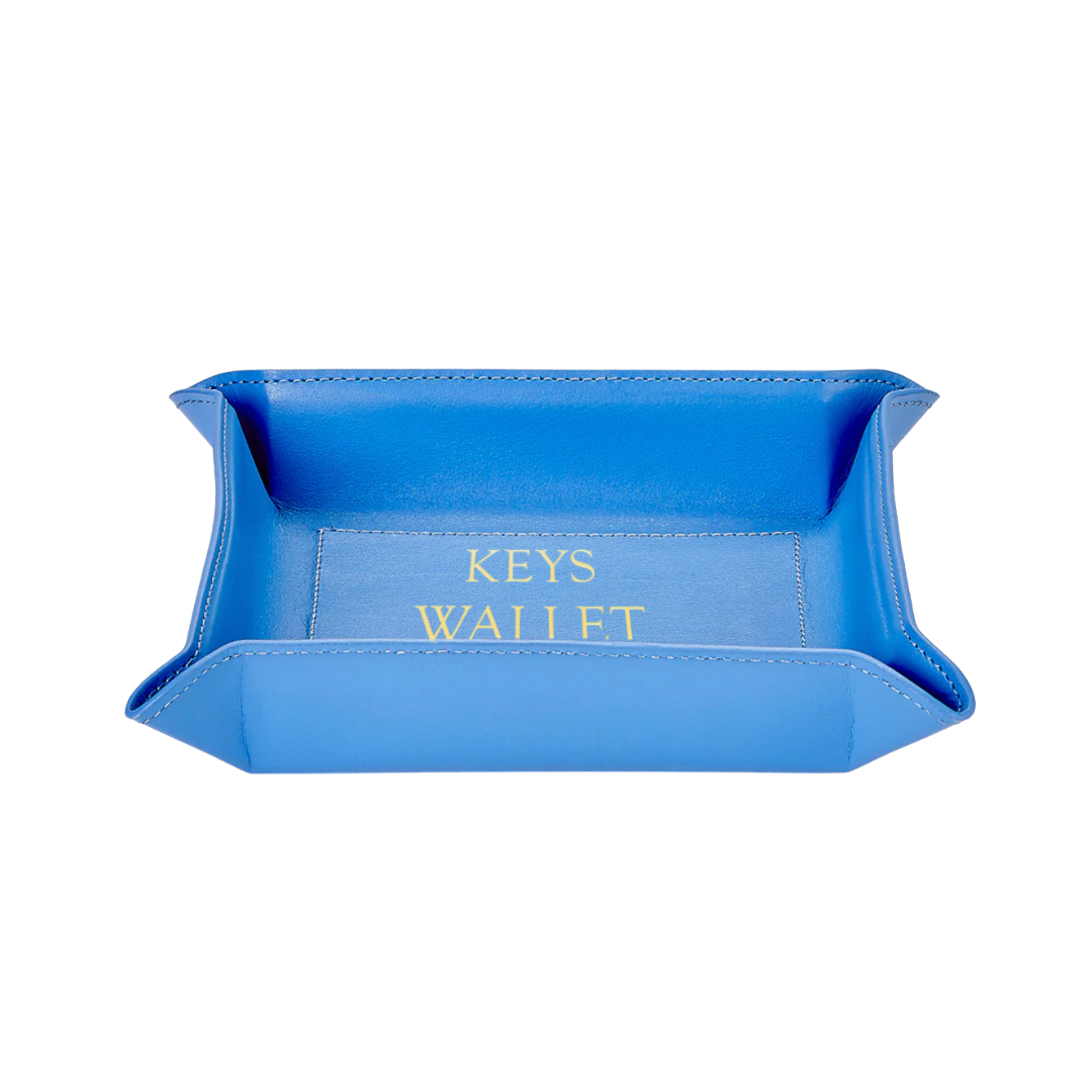 The Graphic Image Leather Valet Tray - Keys Wallet Phone - is a rectangular blue leather catchall with raised edges and "KEYS" and "WALLET" in gold, perfect for organizing essentials elegantly.