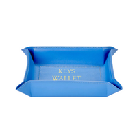 The Graphic Image Leather Valet Tray - Keys Wallet Phone - is a rectangular blue leather catchall with raised edges and "KEYS" and "WALLET" in gold, perfect for organizing essentials elegantly.