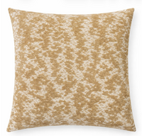 The Coolney Pillow Sand by Decor Fifty-Five features a square, textured design with a beige and off-white mottled pattern, adding subtle elegance to any space. Shown against a white background.