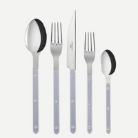 Five pieces from the Sabre Bistrot Pearly 5 Piece Setting - Shiny—including a spoon, fork, knife, salad fork, and teaspoon—each featuring metallic accents and pearlescent handles with round rivets, are arranged in a row on a white background. Expertly crafted in France.