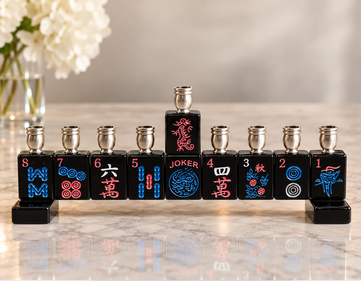 The Eclectic Judaica Mah Jong Menorah - Black features nine metal candle cups on a base of black mahjong tiles, colorful symbols, and a raised central joker tile.
