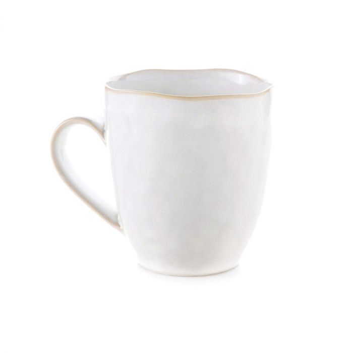 The Simon Pearce Burlington Dinnerware Cloud mug features a white ceramic body with a light tan rim and handle, textured pinch-pot inspired surface, and handcrafted style—perfectly complementing organic-edged plates.