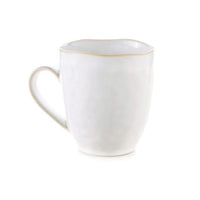 The Simon Pearce Burlington Dinnerware Cloud mug features a white ceramic body with a light tan rim and handle, textured pinch-pot inspired surface, and handcrafted style—perfectly complementing organic-edged plates.