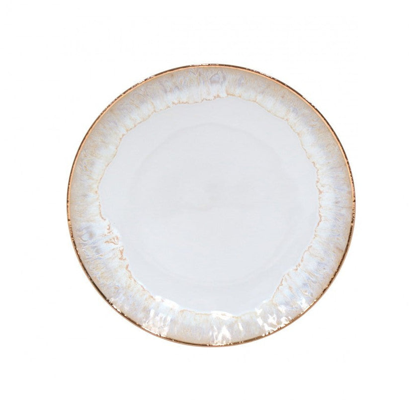 The Taormina Dinnerware White & Gold plate by Casafina/Costa Nova features a round white ceramic design with a hand-painted, irregular 18-karat gold rim and an opalescent sheen, shown against a plain white background.
