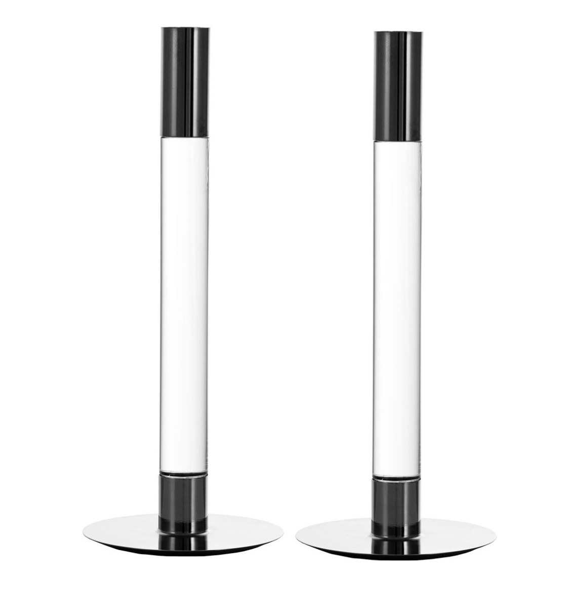 The Lumiere Candlestick Silver Set of 2 by Orrefors Kosta Boda features modern, cylindrical design with black and white accents and flat chrome bases, standing side by side against a white background.
