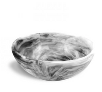 The Nashi Home Swirl Resin Classic Wave Bowl, showcasing a marbled black, white, and gray pattern, is displayed against a white background.