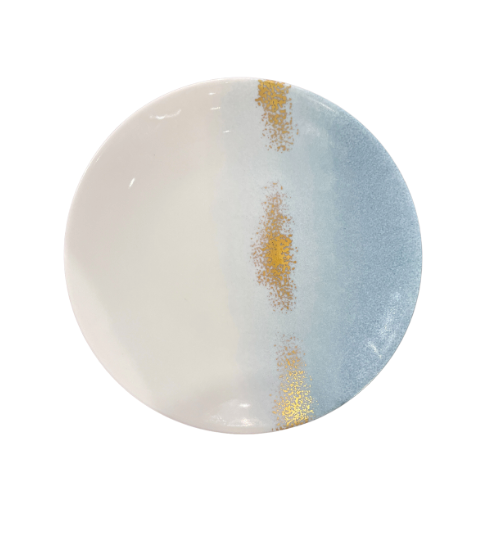 The Marie Daâge Horizon Gold Dinnerware by Marie Daâge features a round ceramic plate with a cream and light blue gradient, accented by two vertical metallic gold lines. Inspired by French tableware, it brings elegance to any setting. Shown on a plain white background.