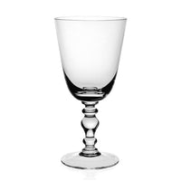 The William Yeoward Fanny Country Drinkware is a handmade crystal wine goblet with a sculpted stem and round base, shown empty on a plain white background.