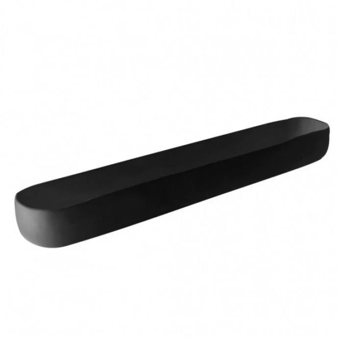 The Tina Frey Trough Black Long is a sleek, minimalist rectangular wall shelf with rounded edges that doubles as stylish table decor or a serving piece, shown against a plain white background.