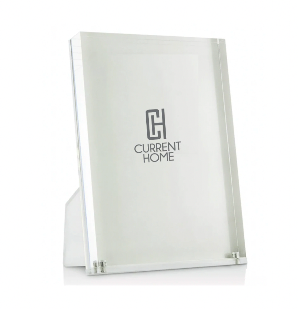 The Lucite Clear Frame by Tizo stands upright, featuring a minimalist design against a plain white background—an ideal modern display solution.