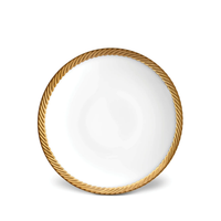 The L'Objet Corde Dinnerware Gold plate is round and white, featuring a hand-painted, textured gold rim with a twisted rope design. Displayed against a plain white background.