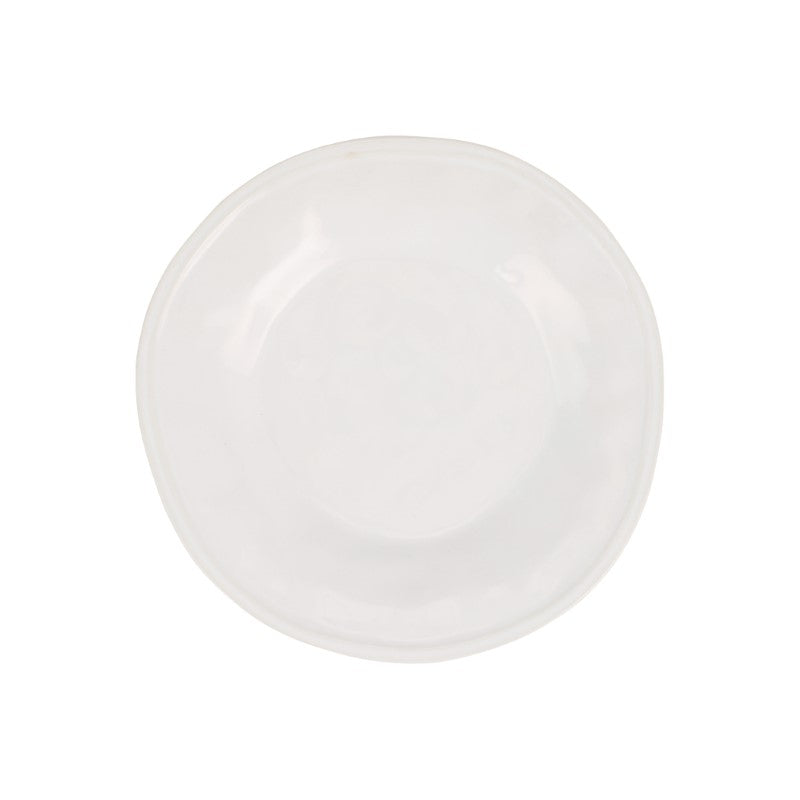 The Aria Dinnerware by Vietri is a handcrafted, round white stoneware plate with an organic, slightly uneven edge, shown from above on a white background.