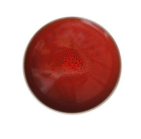 The Tourron Dinnerware Cerise by Jars - Rosenthal is a round ceramic plate featuring a glossy red glaze and crackled center pattern, shown from above on a white background.