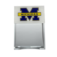 The Eye Candy College Note Pad is a white holder featuring the University of Michigan block M logo in blue and yellow with "MICHIGAN" on top, holding blank white paper notes—a great graduation gift or custom school note pad.