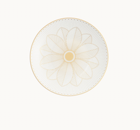 A white Christofle Malmaison Imperiale Porcelain Dinnerware Gold dinner plate, featuring a central gold geometric flower pattern and a delicate dotted gold border.