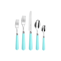 The Capdeco Altea Flatware 5 PPS set features five utensils—two forks, a knife, a tablespoon, and a teaspoon—with shiny metal tops and light blue handles, all neatly displayed on a white background.