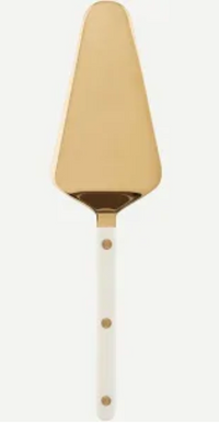 The Sabre Bistro Pearly Gold Tart Server features a gold metal triangular blade and a white acrylic handle with three gold rivets, from the elegant Bistrot collection, shown on a light background.