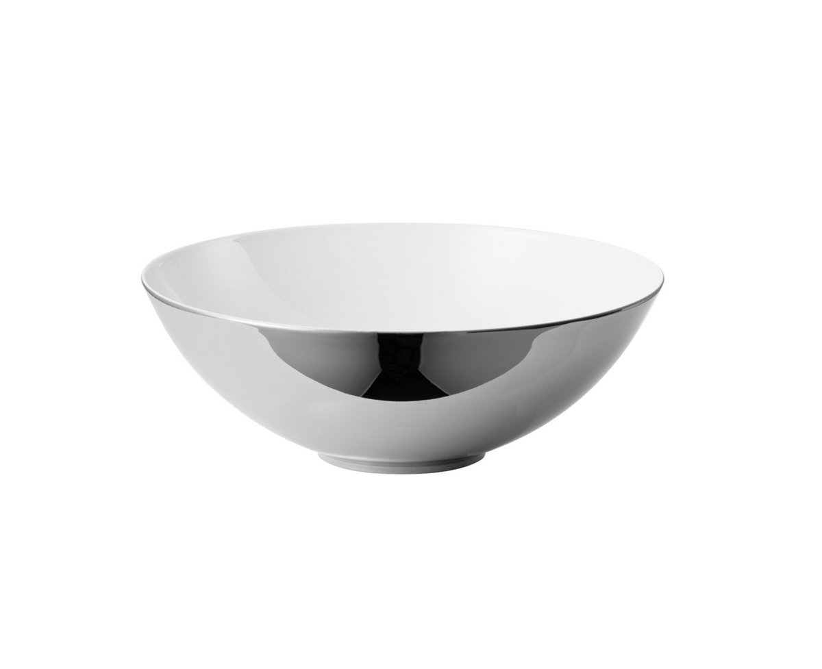 The Rosenthal Skin Platinum TAC 02 Dinnerware bowl features a reflective silver exterior, platinum accents, and a white interior, displayed elegantly on a plain white background.