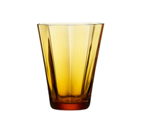 The Daphne Glassware- Amber by Kim Seybert is a mouth-blown, translucent amber wine glass tumbler with smooth, angled sides and a slightly flared rim, highlighting Czech artistry against a plain white background.