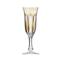 The Lady Hamilton Champagne Glass 140ml by Moser features elegant vertical facets, a flared rim with a subtle gold tint, and a slender stem—hand-cut crystal inspired by Lady Hamilton drinkware, shown against a white background.