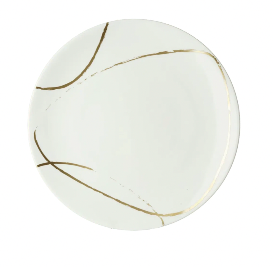 The Sketch Chalk Dinnerware by Royal Crown Derby is a round white English fine bone china plate featuring an abstract design of thin, curved gold lines.