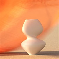The Hushed Matte Vase by Global Views / Surya, featuring a modern white ceramic hourglass design, stands on a neutral surface with a softly blurred orange background.