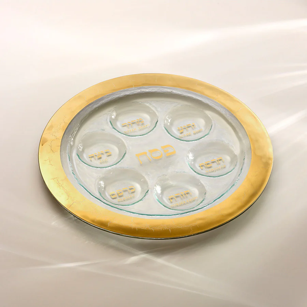 The Annieglass Judaica Seder Plate Gold is a glass Seder plate with a gold rim and Hebrew text for the Seder symbols—an elegant Passover plate and thoughtful Jewish wedding gift.