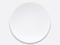 Bernardaud's Organza White Dinnerware, crafted from Limoges porcelain and featuring a subtle crisscross texture, is shown on a light gray background—an ideal accent for minimalist interiors.