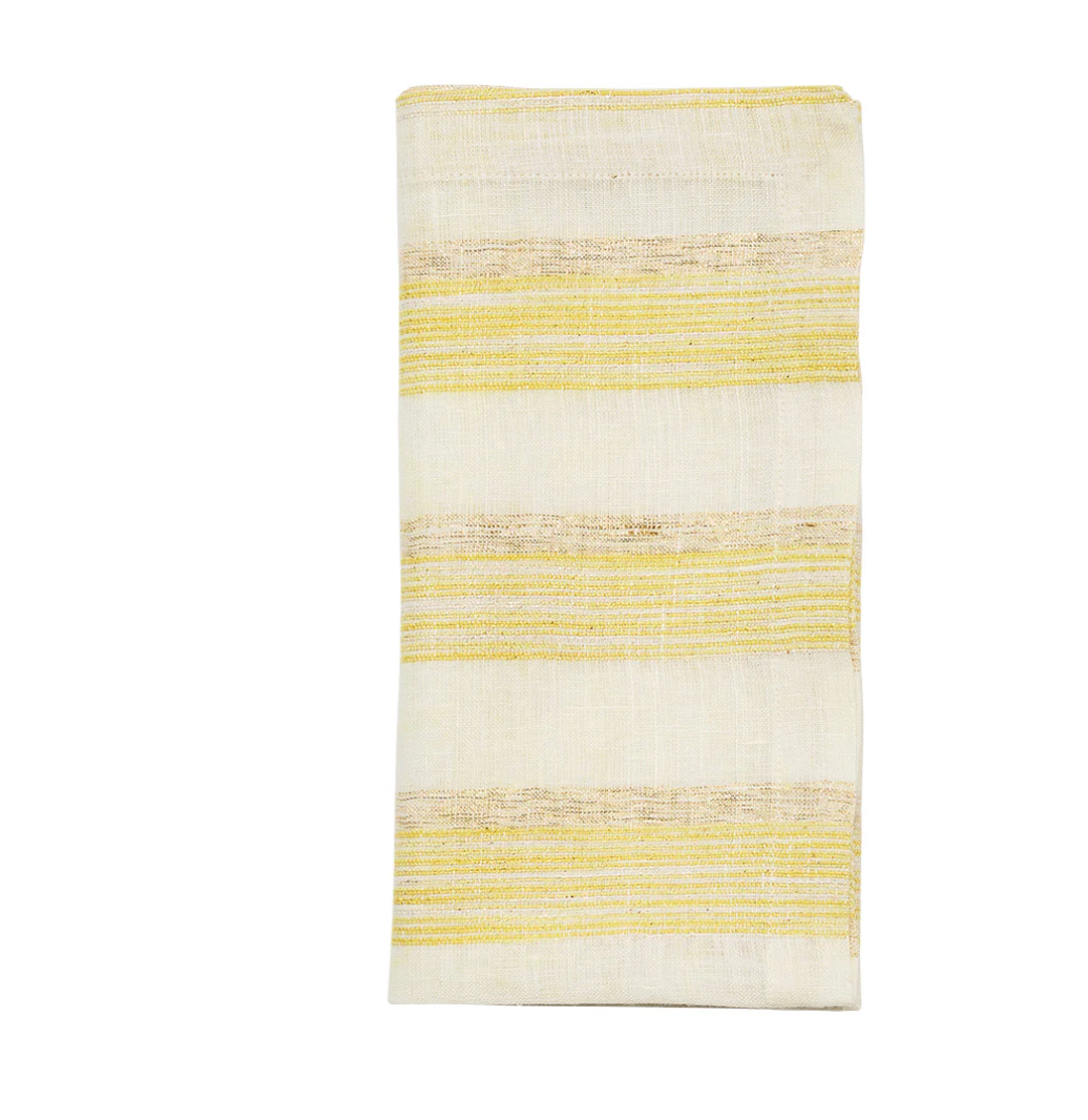 The Kim Seybert Broad Stripe Napkin Set of 4 in yellow and white features folded cream napkins with horizontal yellow stripes, ideal for a relaxed coastal table setting.