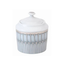 A white Limoges porcelain jar with lid from the Philippe Deshoulieres BIA Arcades Platinum Dinnerware, featuring a silver and gray geometric arch pattern, rounded top handle, and made in France.