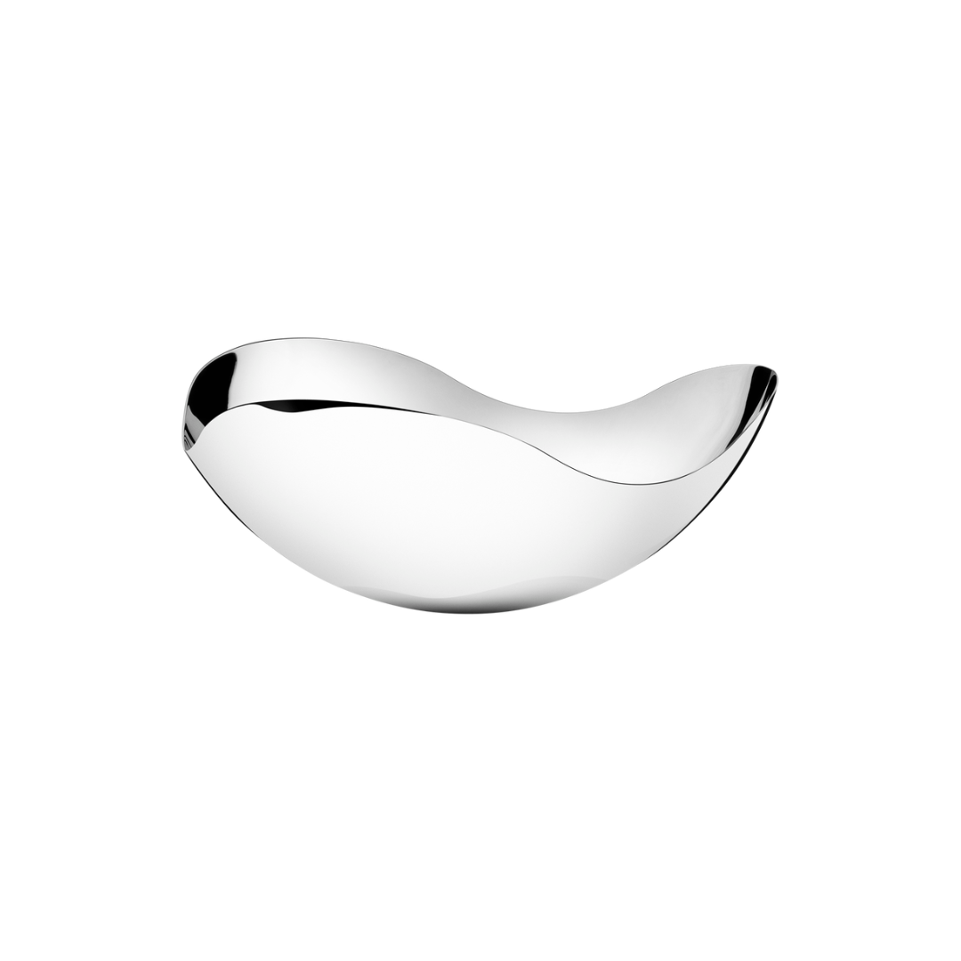 The Bloom Serving Bowl by Georg Jensen features a modern, mirror-polished stainless steel design with flowing curved edges, presented against a plain white background.