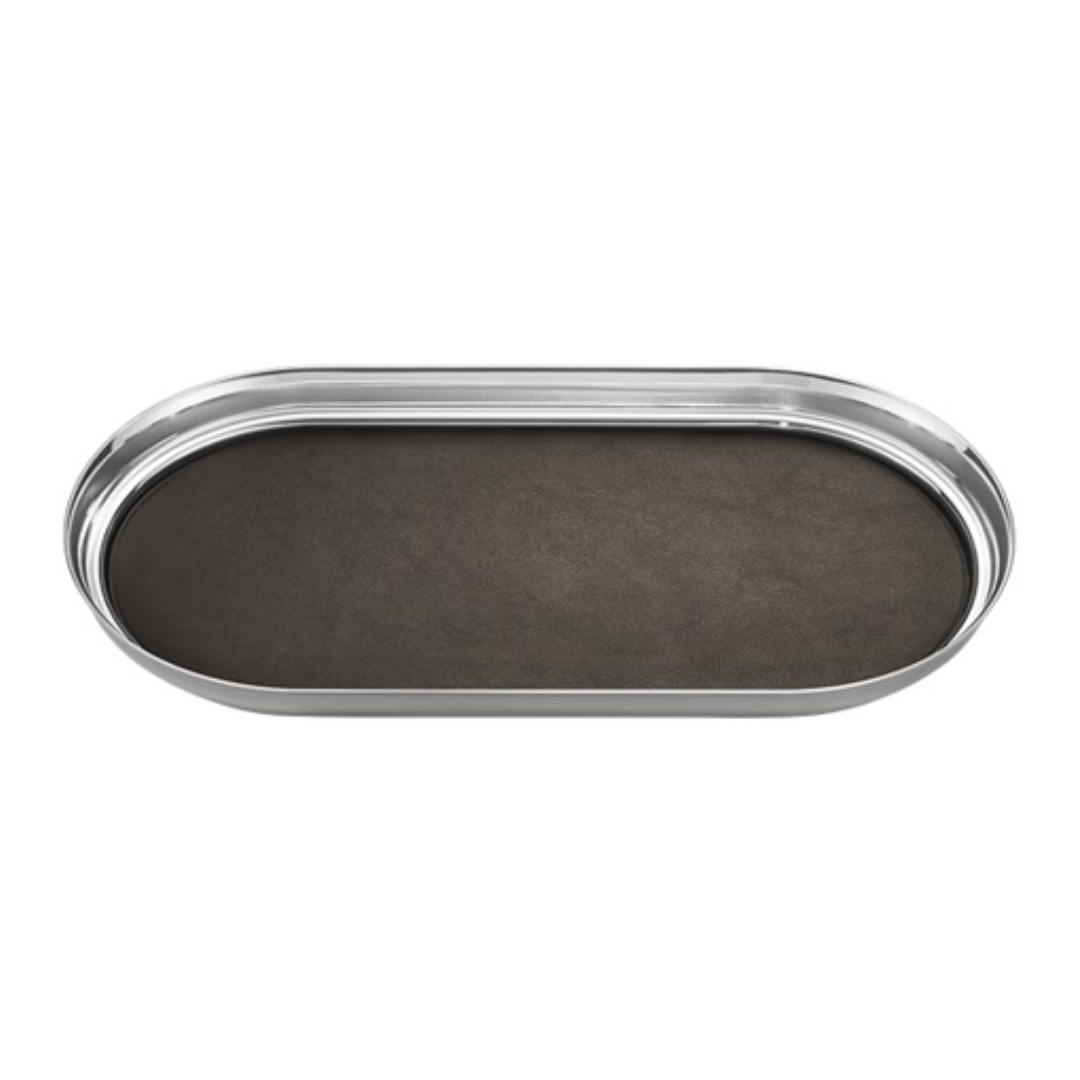 The Georg Jensen Manhattan Tray With Leather Liner features an oval Art Deco design, a dark matte leather center, and shiny silver edges, elegantly displayed from above on a white background.
