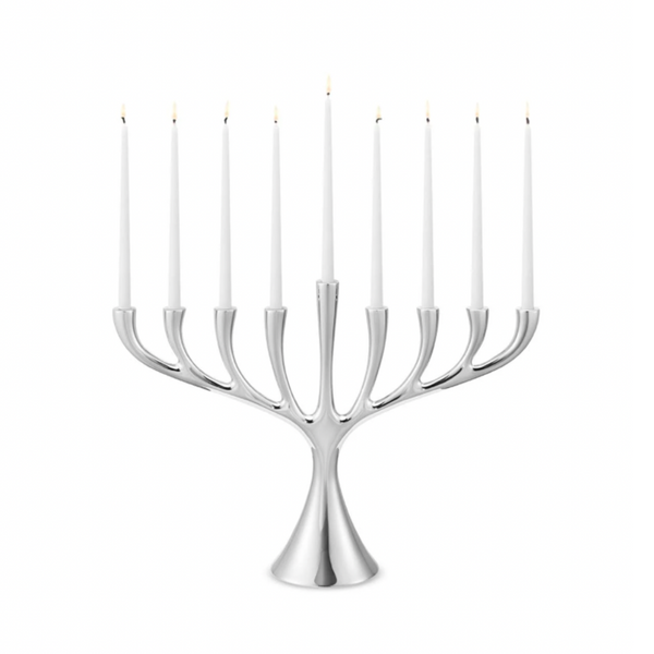 The Georg Jensen Cobra Stainless Steel Menorah displays nine lit white candles in a modern Scandinavian design, set against a plain white background.