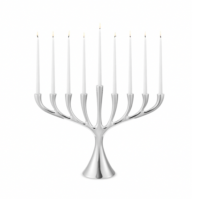 The Georg Jensen Cobra Stainless Steel Menorah displays nine lit white candles in a modern Scandinavian design, set against a plain white background.