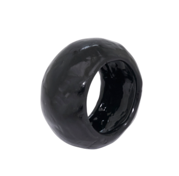 The Saro Trading Capiz Napkin Ring Set of 4 in glossy black features chunky, handmade rings with a unique shape—ideal for adding style to organic table settings. Displayed on a plain white background.