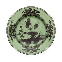 The Oriente Italiano Dinnerware Bario by Ginori 1735 is a decorative green Italian porcelain plate with scalloped edges, showcasing intricate black chinoiserie floral and landscape patterns on the rim and center.