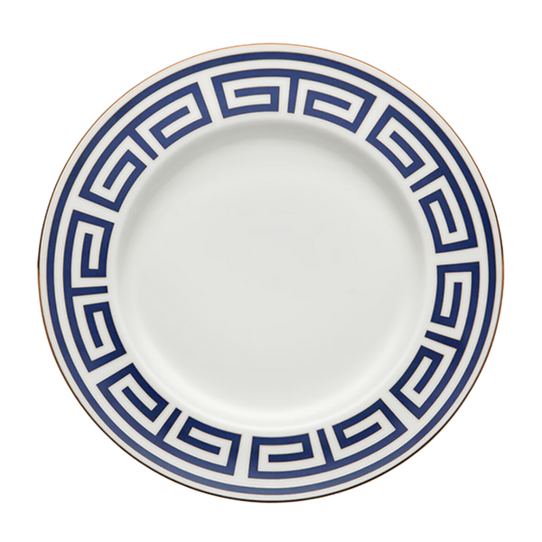 The Ginori 1735 Labirinto Zaffiro Dinnerware features a porcelain plate adorned with a blue Greek key motif and a gold rim.