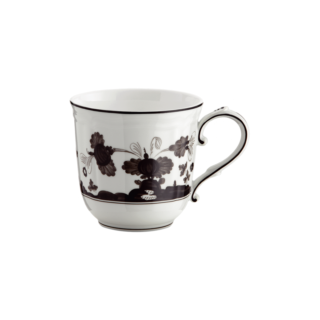 A Ginori 1735 Oriente Italiano Dinnerware Albus porcelain teacup with a black floral pattern, curved handle, and thin black rim, set against a plain white background.