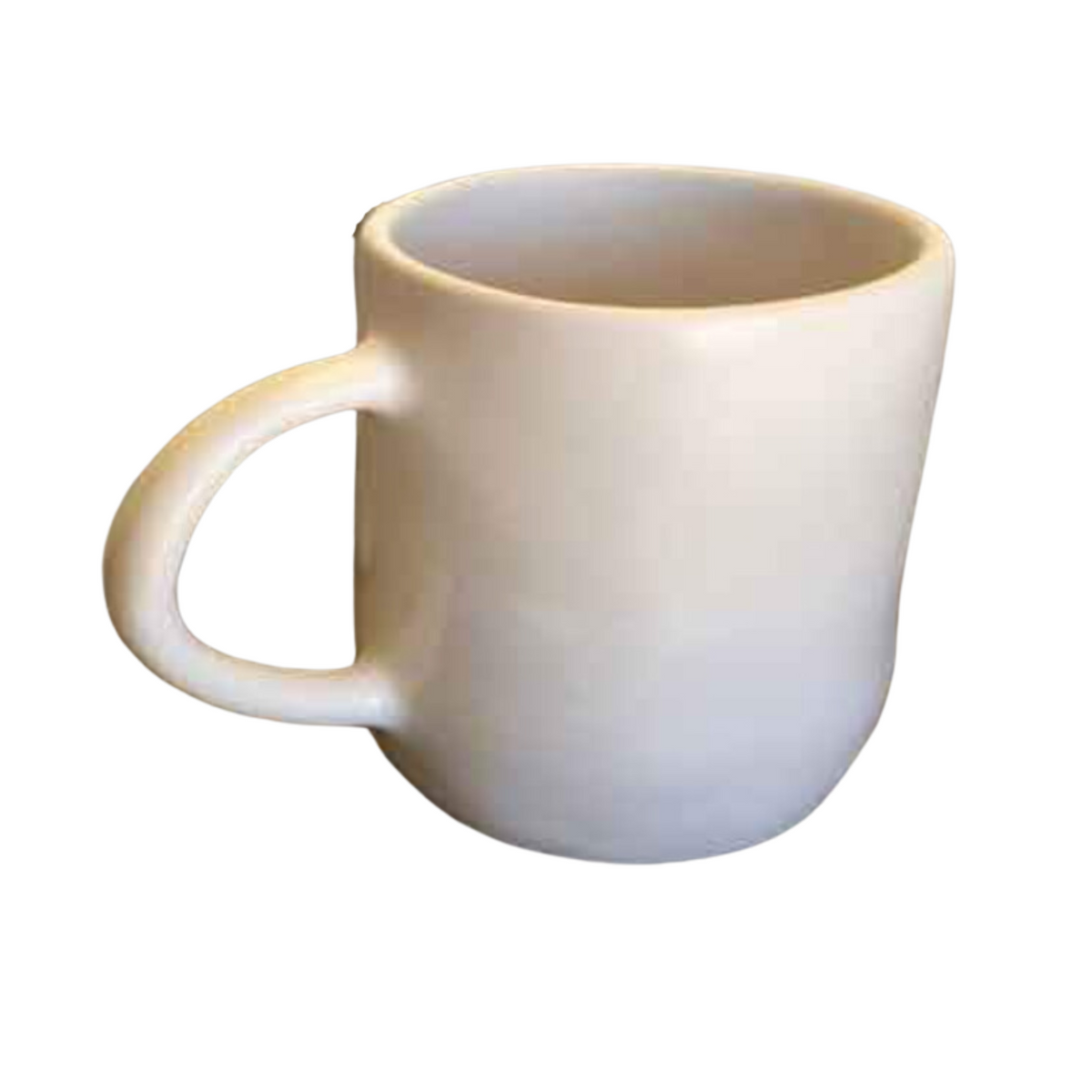The Urban Dinnerware Matte White mug by Alex Marshall Studios features a plain white ceramic design with a large handle and curved base, pairing perfectly with handmade ceramic plates or stoneware dinnerware for a timeless table setting.