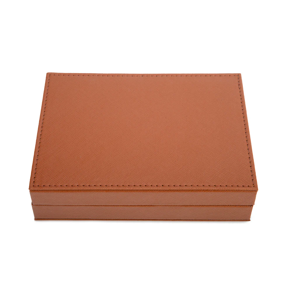 The Rowan Poker Card Set by Brouk & Co is a closed, rectangular brown vegan leather case with visible edge stitching, shown on a white background.