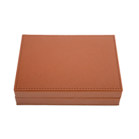 The Rowan Poker Card Set by Brouk & Co is a closed, rectangular brown vegan leather case with visible edge stitching, shown on a white background.