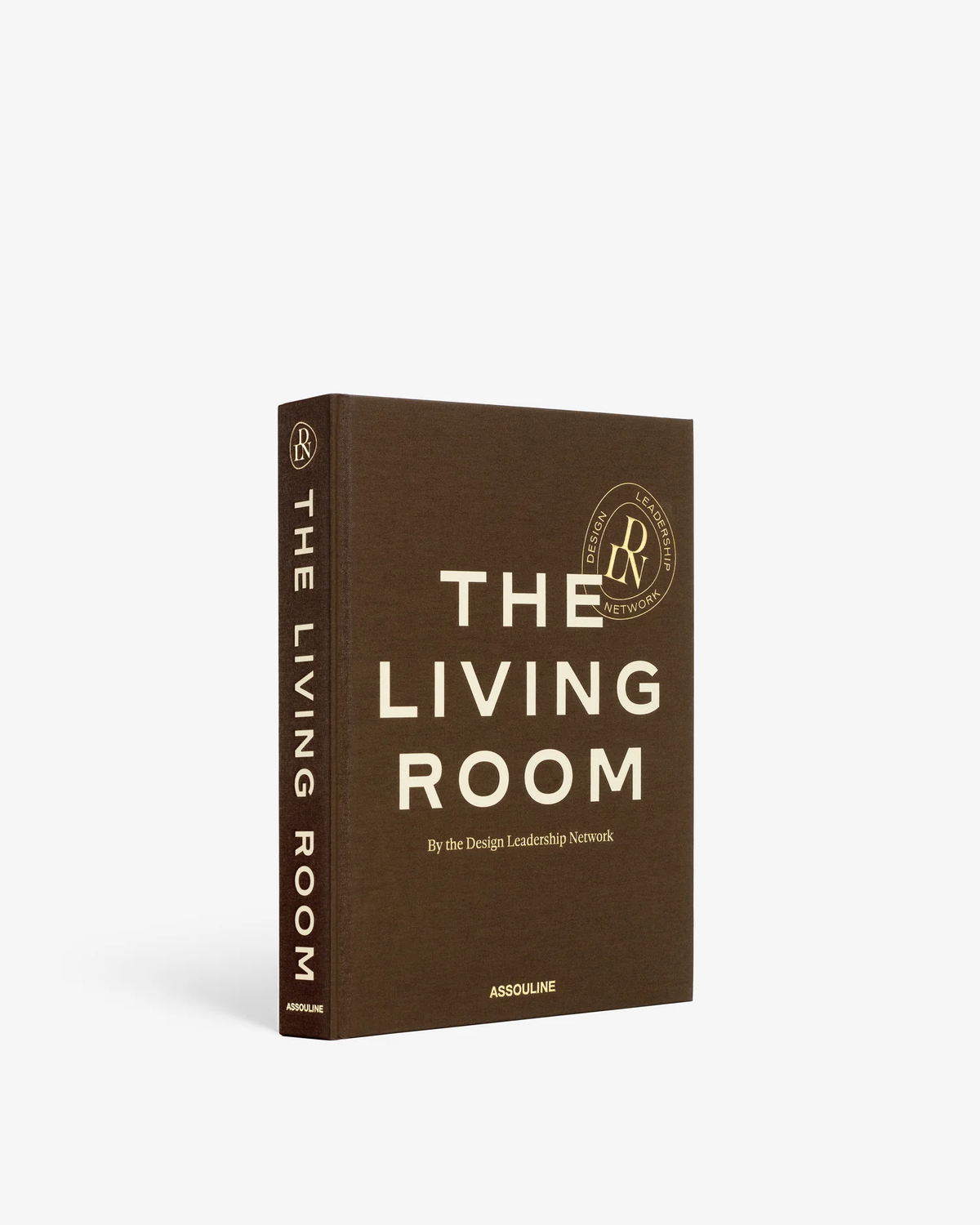 A brown book titled "The Living Room" by Assouline. The spine reads THE LIVING ROOM.