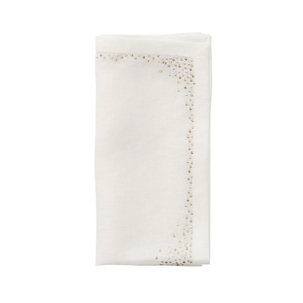 A folded white linen napkin from the Kim Seybert Pin Dot Napkin Set of 4, featuring a subtle beaded design along the border on two adjacent sides, is displayed on a plain white background. This elegant table napkin set brings a refined touch to any dining setting.