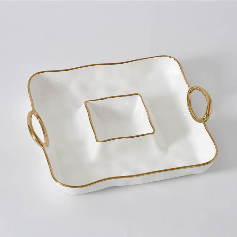 The PAMPA BAY Golden Handle Square Chip & Dip - NEW features wavy edges, gold trim, and two gold handles, plus a central square compartment ideal for dips or sauces—an elegant porcelain serving dish for any occasion.