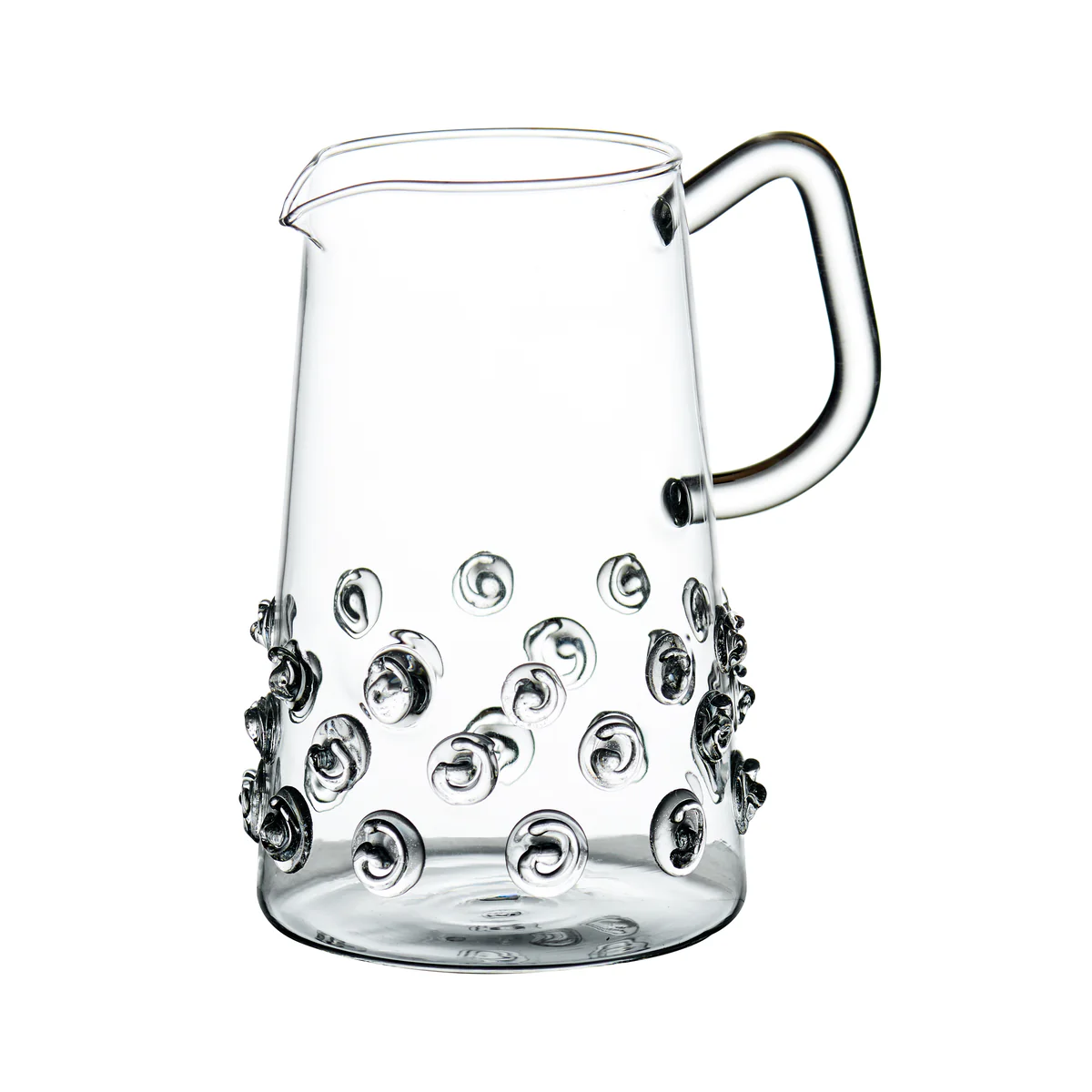 The Swirl Glass Pitcher by Abigails features mouth-blown clear glass, a curved handle and spout, and decorative glass circles—making this small pitcher an ideal choice for serving drinks or enhancing your bar mixers collection.