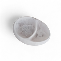 The Arila Split Bowl – White Swirl by Nashi Home is a stylish white, round serving bowl with elegant swirls, perfect for coastal decor and contemporary interiors.